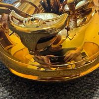 Serial # unknown. Source: rusbra_0 on eBay.com low A bari sax, Dave Guardala Artist Series baritone saxophone, floral engraving, lacquer saxophone