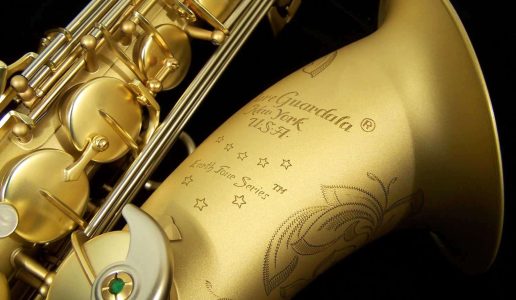 Earth Tone tenor #015149. Source: Dave Kessler DG-503ET tenor sax, Dave Guardala tenor saxophone, B&S, matt gold finish with gold lacquer inner bell, extensive floral engraving all over