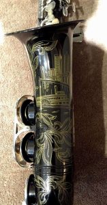 Source: qlflflr on eBay.com DG-402 alto sax, New York Series, series features NY skyline features engraved all over the keywork & bell, rich engraving all over the instrument, Dave Guardala alto saxophone, black nickel plate with silver plated keys,