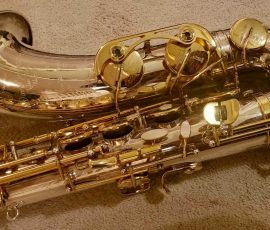 Source: adbforyour on eBay.com DG-502 tenor sax, New York Series, series features NY skyline features engraved all over the keywork & bell, rich engraving all over the instrument, Dave Guardala tenor saxophone, silver plate with gold plated keys,