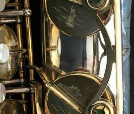 Source: adbforyour on eBay.com DG-502 tenor sax, New York Series, series features NY skyline features engraved all over the keywork & bell, rich engraving all over the instrument, Dave Guardala tenor saxophone, silver plate with gold plated keys,